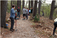 A staff member directs volunteers as they prepare to plant.