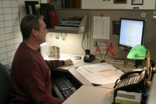 Detective at Work on a Computer