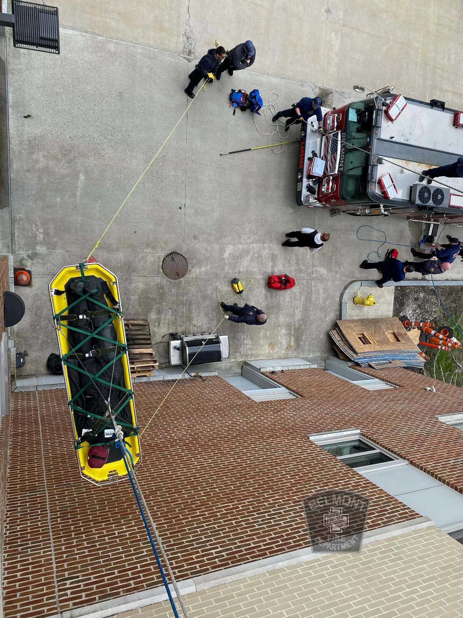 Looking down From the Top of a Building While a Training to Lower Stretcher